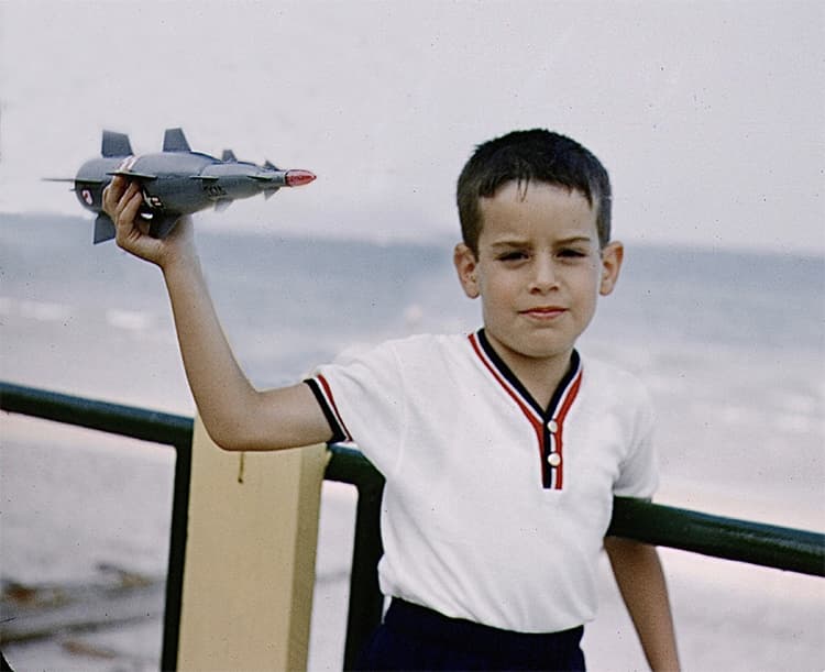 Picture of Charles Slatkin as a boy with a model jet.